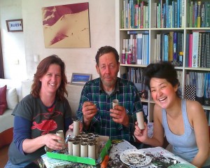 Rachel, John, Karlie putting seeds into loo rolls