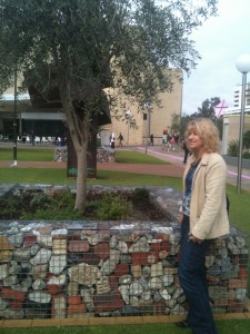 Olive tree in gabion wall in Perth's Urban Orchard and one of my hosts, Jana