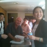 Bing the interpreter explains as I sign a copy of Sustainable House book for the delegation
