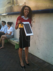 Monique and her solar powered light and phone charger